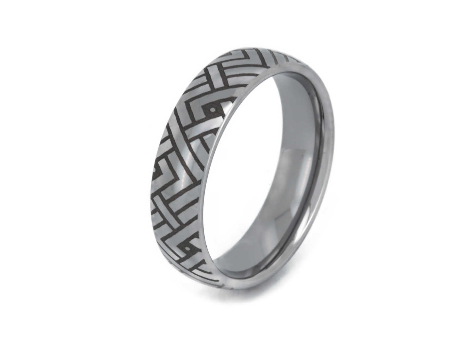 The Labyrinthine Loop tungsten ring with laser-engraved surface detail, shown against a light background.