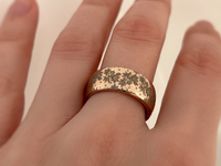 Product photo of the Blooming Grace tungsten ring with laser-engraved surface detail.