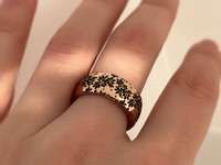 Blooming Grace tungsten ring with laser-engraved surface detail, worn on a hand.
