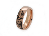 Black Blooming Rose tungsten ring with laser-engraved surface detail, shown against a light background.