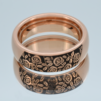 Product photo of the Black Blooming Rose tungsten ring with laser-engraved surface detail.