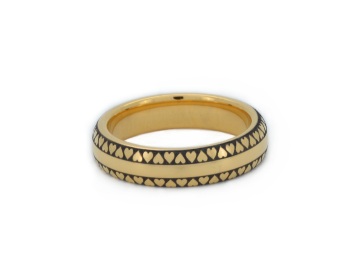 Tungsten Gold 'Eternal Love Band' featuring a continuous black heart pattern against a golden background