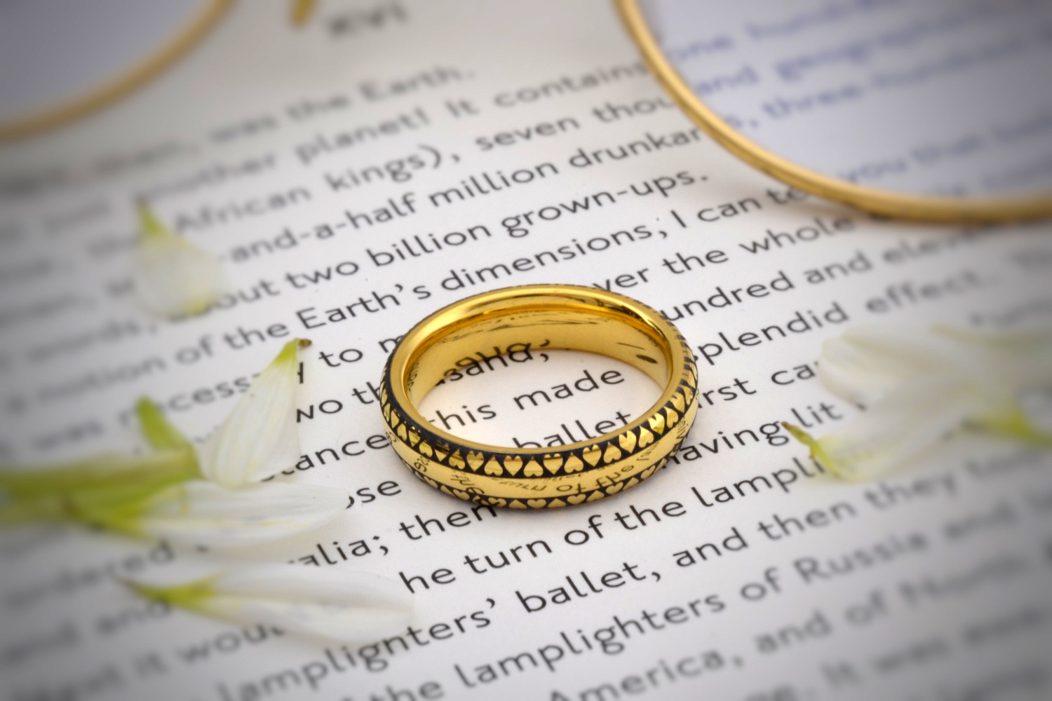 Tungsten Gold 'Eternal Love Band' featuring a continuous black heart pattern against a golden background