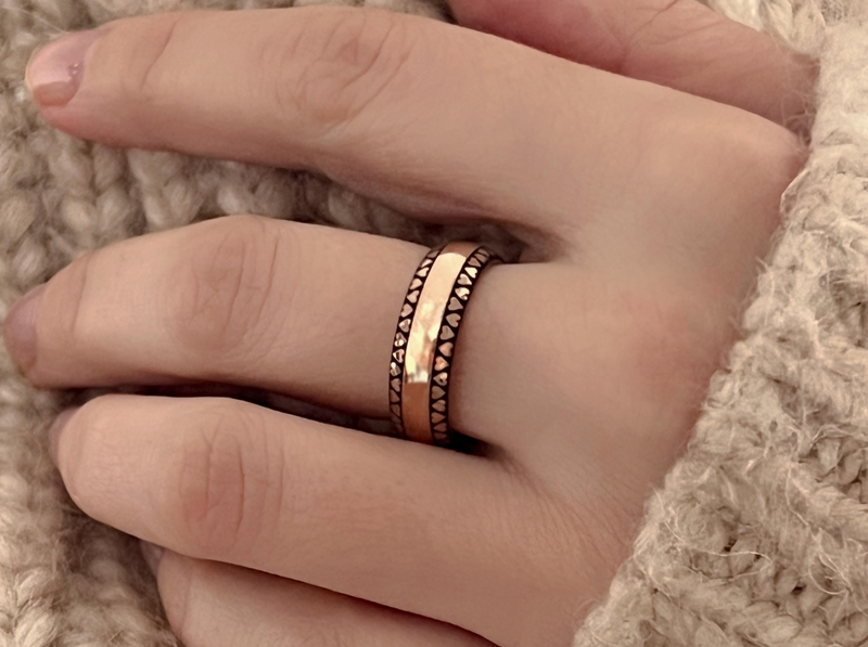 Eternal Love Band with laser-engraved surface detail, worn on a hand.