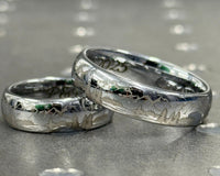 Product photo of the Mountains tungsten ring with laser-engraved surface detail.