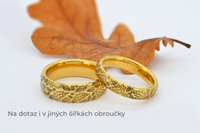 Product photo of the Delicate Oak Leaf tungsten ring with laser-engraved surface detail.
