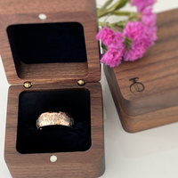 Product photo of the Blooming Grace tungsten ring with laser-engraved surface detail.