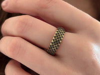 The Regal Weave tungsten ring with laser-engraved surface detail, worn on a hand.
