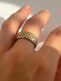 Celestial Grid tungsten ring with laser-engraved surface detail, worn on a hand.
