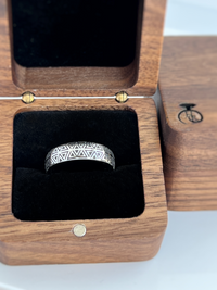 Product photo of the Prism Illusion tungsten ring with laser-engraved surface detail.