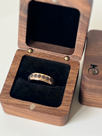 Product photo of the Eternal Blossom tungsten ring with laser-engraved surface detail.