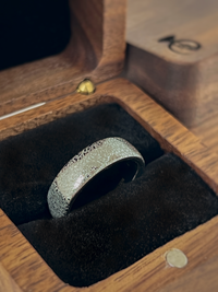 Product photo of the Baroque Elegance tungsten ring with laser-engraved surface detail.
