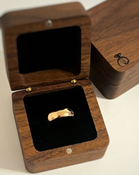 Product photo of the High Polished Rose Gold Tungsten Wedding Band with a polished plain surface.