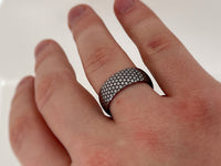 Eclipse Harmony Ring with laser-engraved surface detail, worn on a hand.