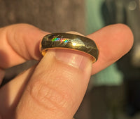 Product photo of the Holographic Inscription tungsten ring with a laser-created holographic surface effect.