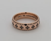 Product photo of the Folk Heritage tungsten ring with laser-engraved surface detail.