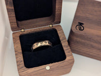 Product photo of the Folk Heritage tungsten ring with laser-engraved surface detail.