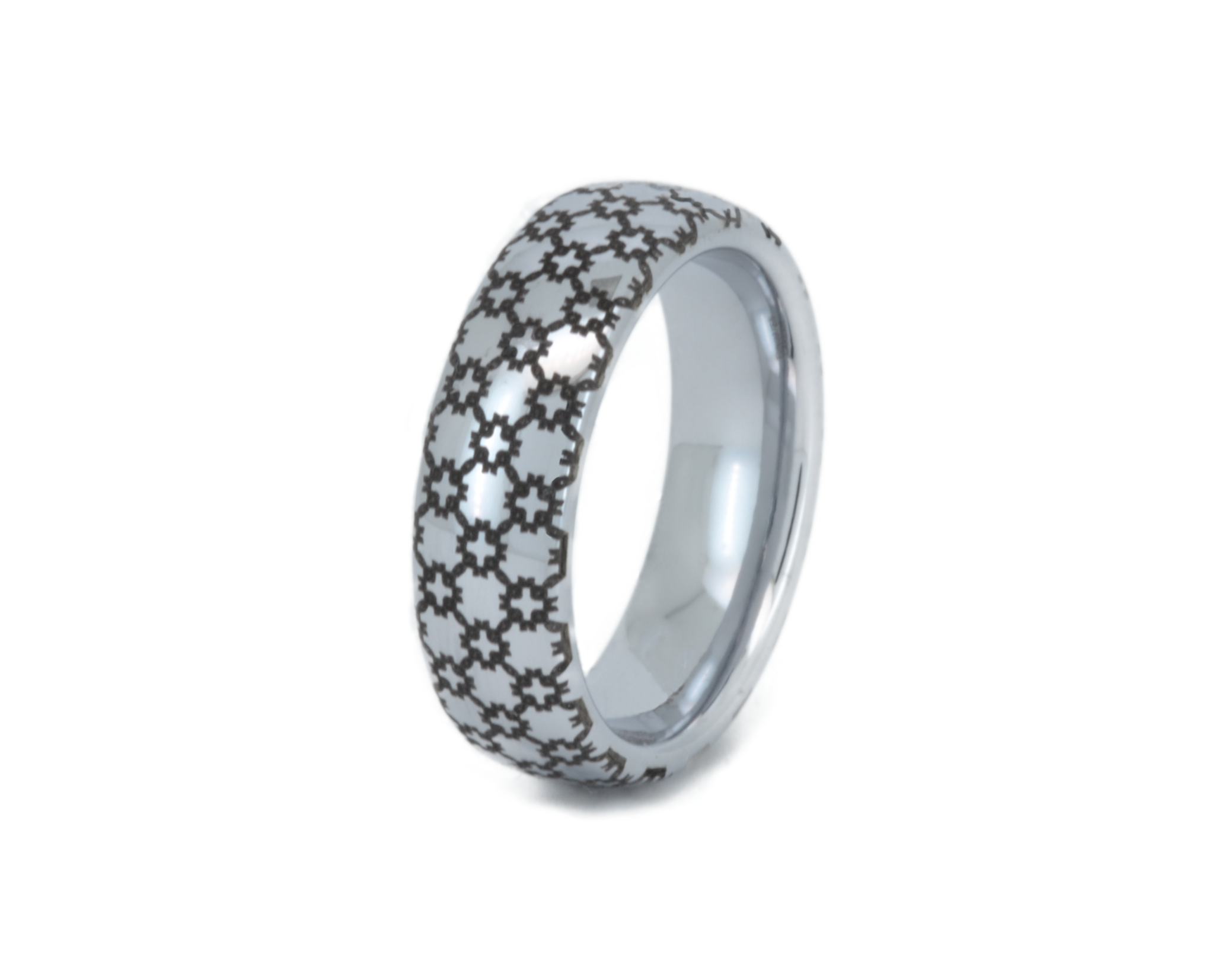 Silver ring with star pattern on a white background