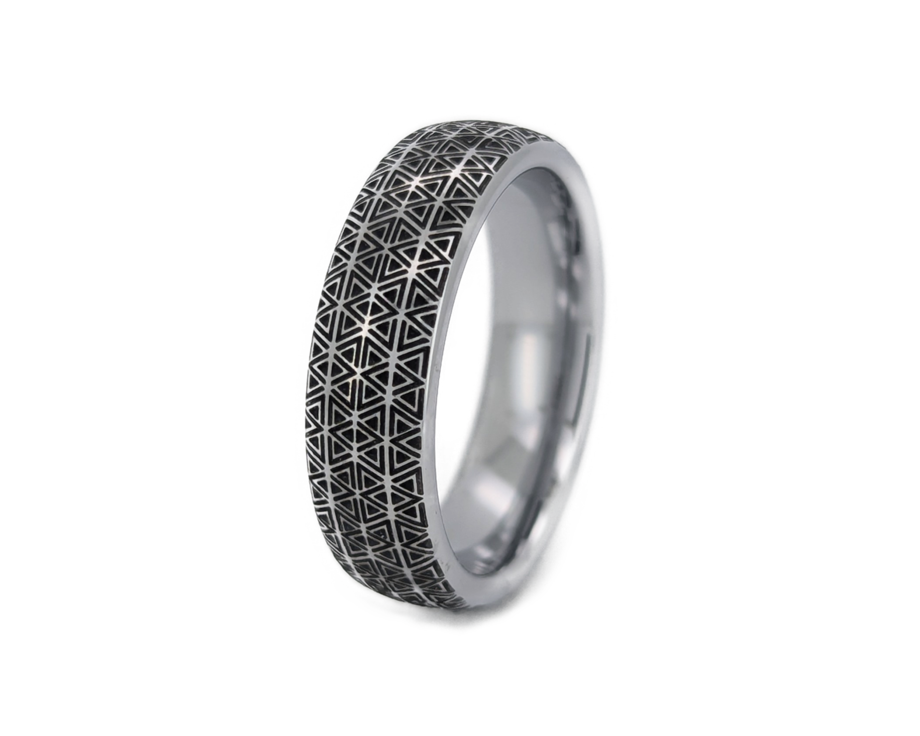 Silver ring with geometric pattern on a white background