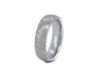Floral Reverie tungsten ring with laser-engraved surface detail, shown against a light background.