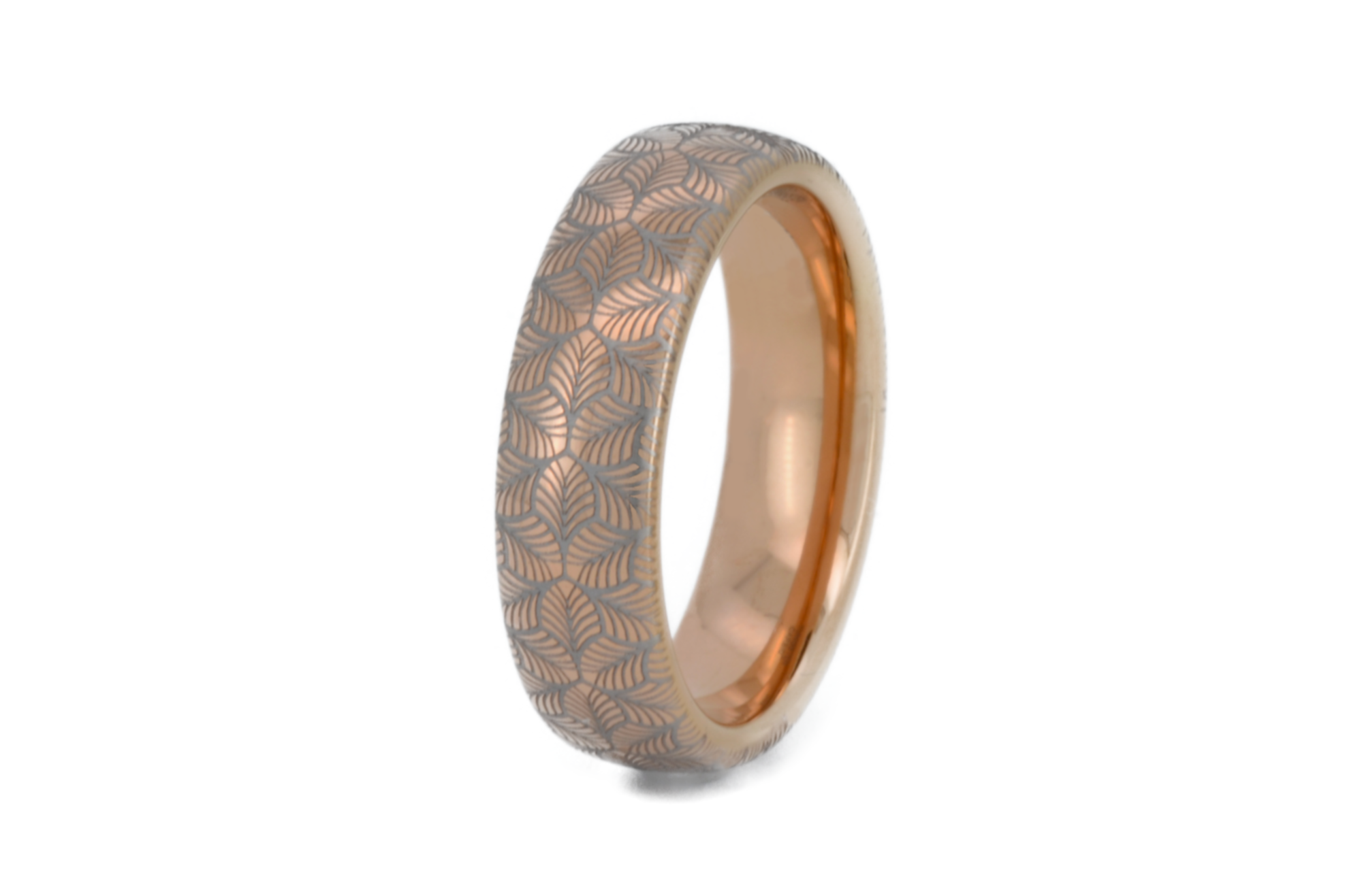 Rose gold tungsten ring with an intricate, white-engraved petal-like pattern, on a white background offering a delicate and refined look, perfect for weddings, special occasions, or everyday wear.