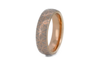 Petal Dance tungsten ring with laser-engraved surface detail, shown against a light background.