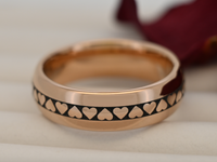 Product photo of the Eternal Heart Band with laser-engraved surface detail.