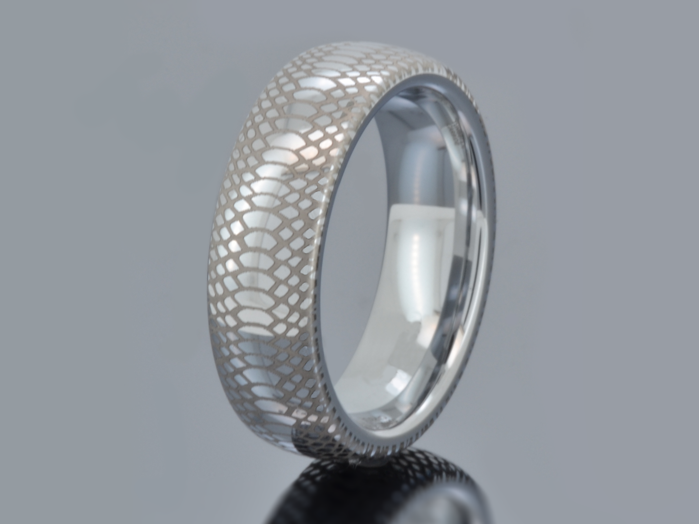 Stylish Serpente Eterno tungsten wedding band featuring a detailed serpent scale design. Durable and hypoallergenic tungsten ring with high-gloss polish, ideal for gifting.
