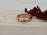 Product photo of the Eternal Heart Band with laser-engraved surface detail.