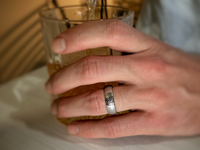 The Arrow Waves tungsten ring with laser-engraved surface detail, worn on a hand.