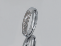 Product photo of the Silver Blooming Rose tungsten ring with laser-engraved surface detail.