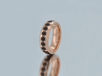 Product photo of the Eternal Blossom tungsten ring with laser-engraved surface detail.