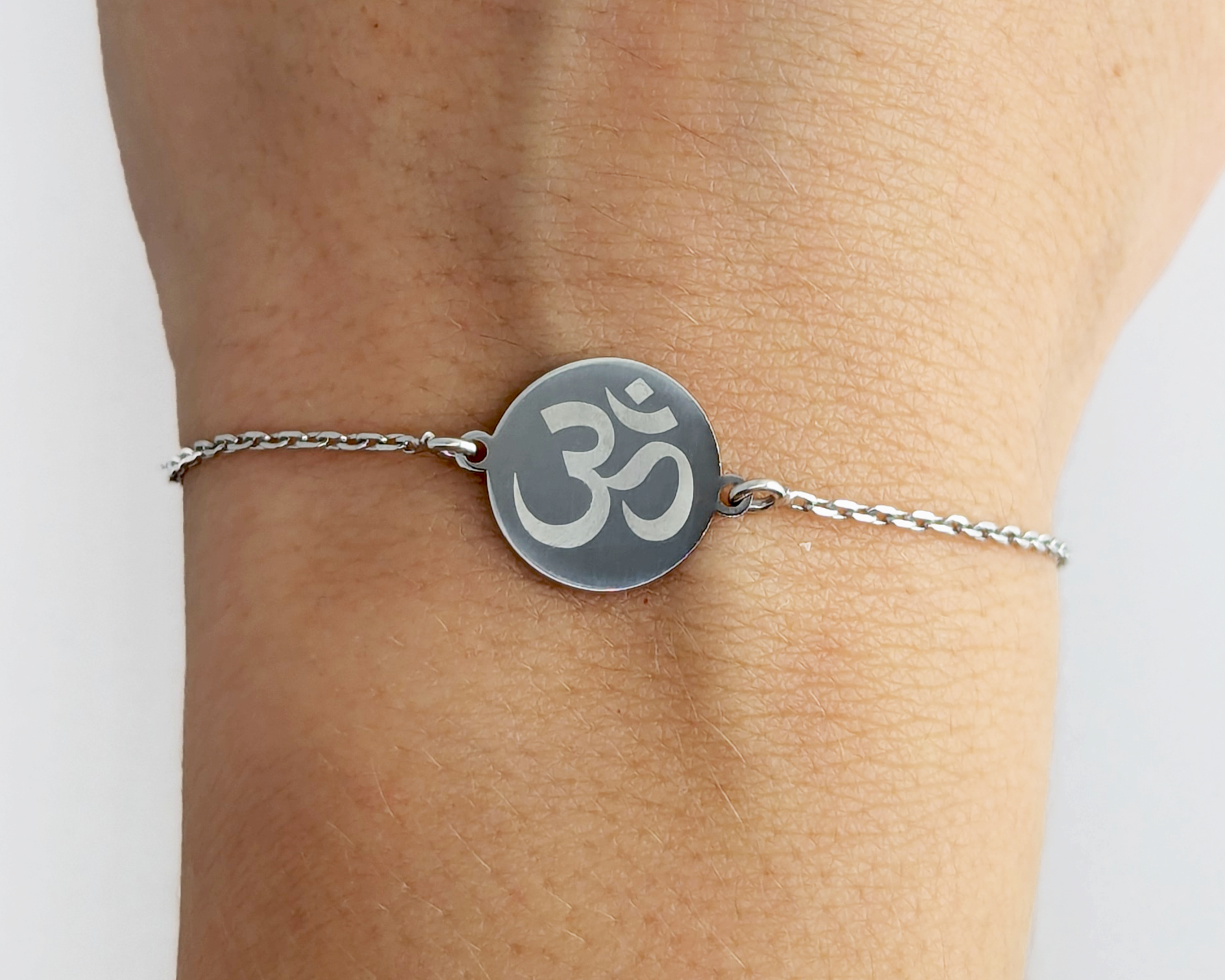 Personalized silver bracelet with engraved om symbol