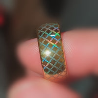 Video preview of the Quilted Grace tungsten ring showing the holographic effect shifting in the light.