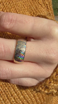 Video preview of the Mokume Radiance tungsten ring showing the holographic effect shifting in the light.