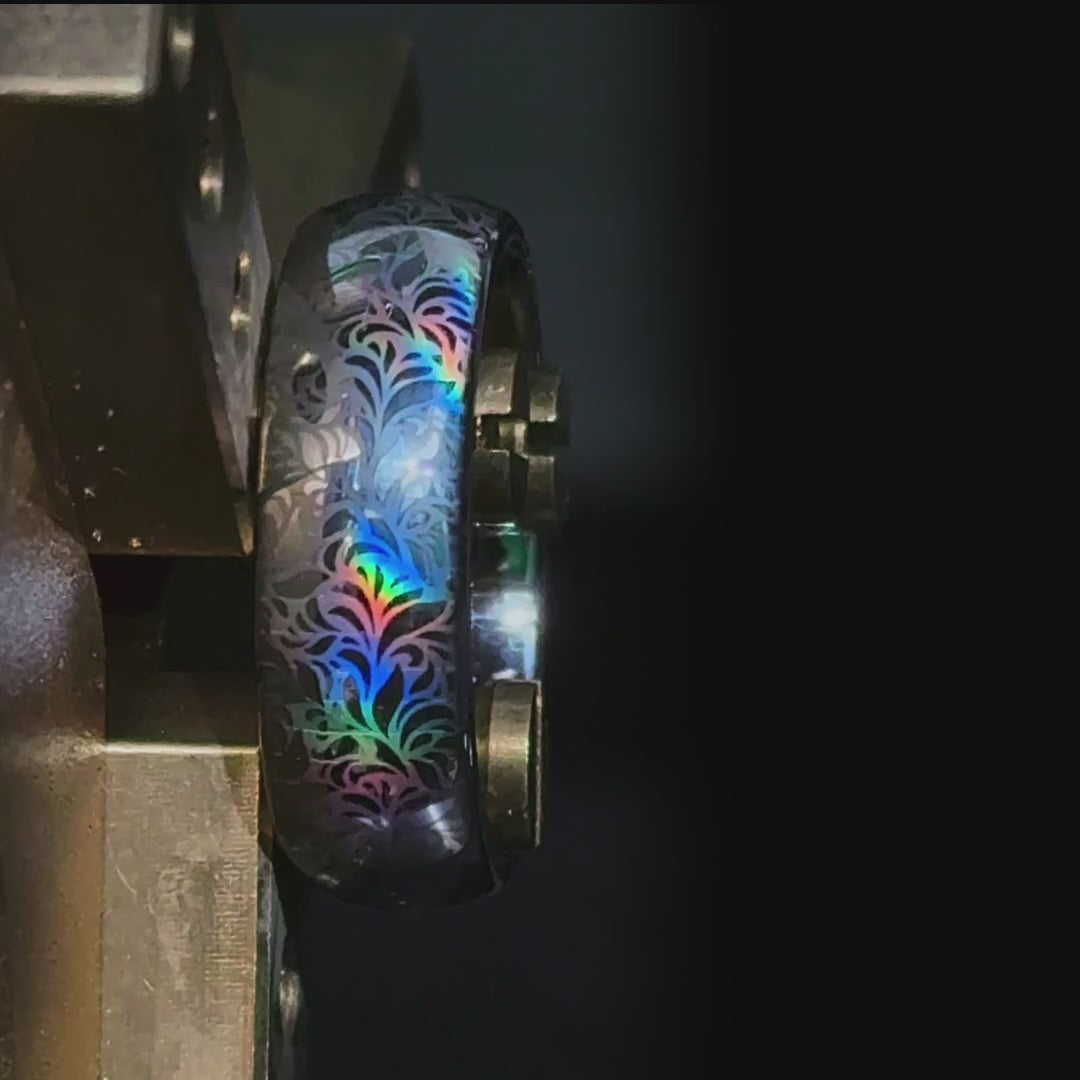 Video preview of the Glowing Reverie tungsten ring showing the holographic effect shifting in the light.