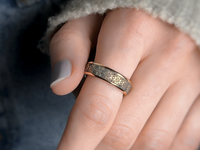 Tribal Pixels tungsten ring with laser-engraved surface detail, worn on a hand.
