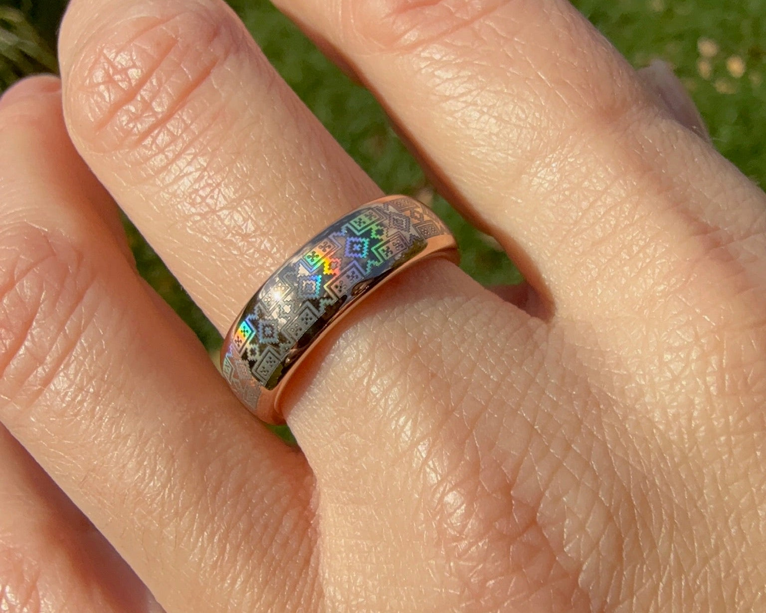 Beautiful holographic ethnical pattern on gold tungsten ring