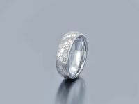 Product photo of the Chain of Unity tungsten ring with laser-engraved surface detail.